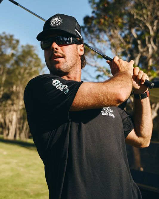 The Mad Hueys Hittin Fk All Short Sleeve Golf Polo | Black