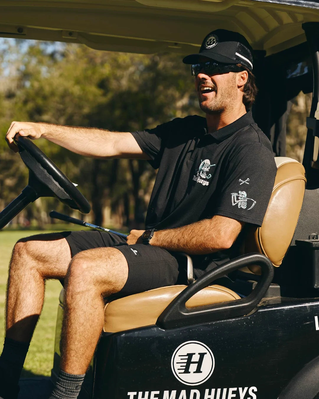 The Mad Hueys Hittin Fk All Short Sleeve Golf Polo | Black