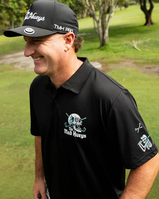 The Mad Hueys Hittin Fk All Short Sleeve Golf Polo | Black